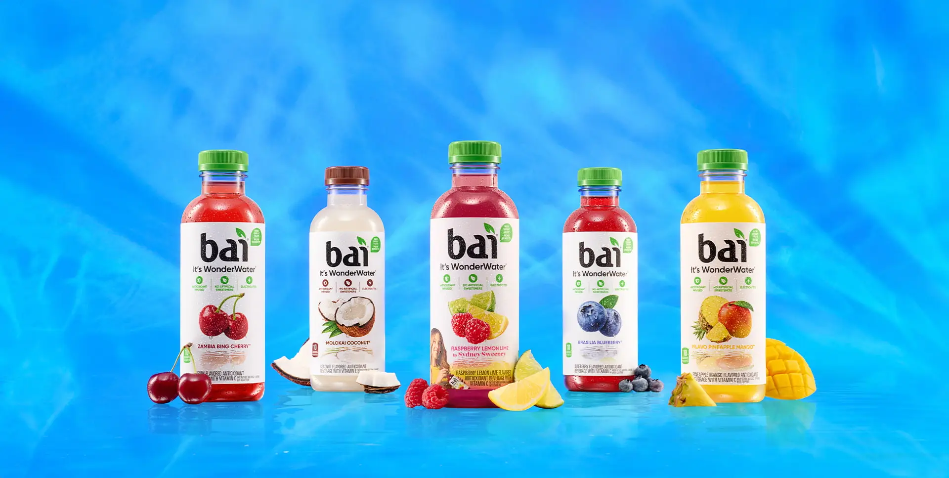 Bai Bottles next to fruit representing their flavors